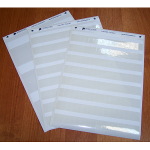 Self-laminating cable labels for laser printers